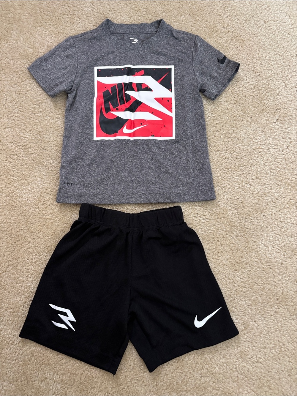 Nike Kids Gray Graphic Tee with Red and Black Logo